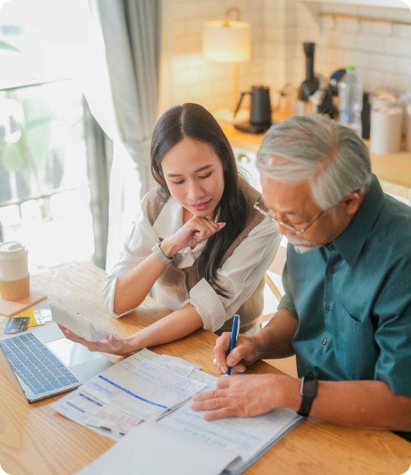 Elderly man and woman reviewing documents